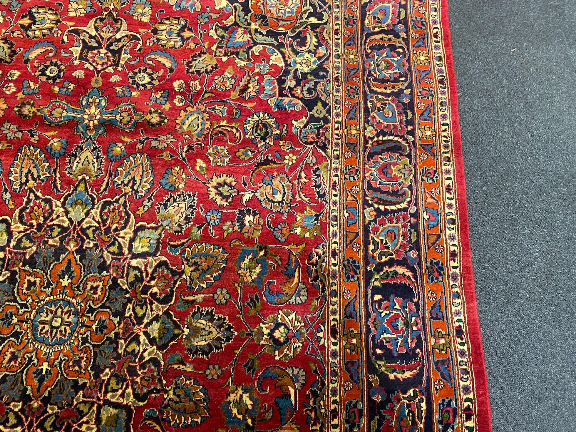 A Kashan claret ground carpet, 375cm x 250cm